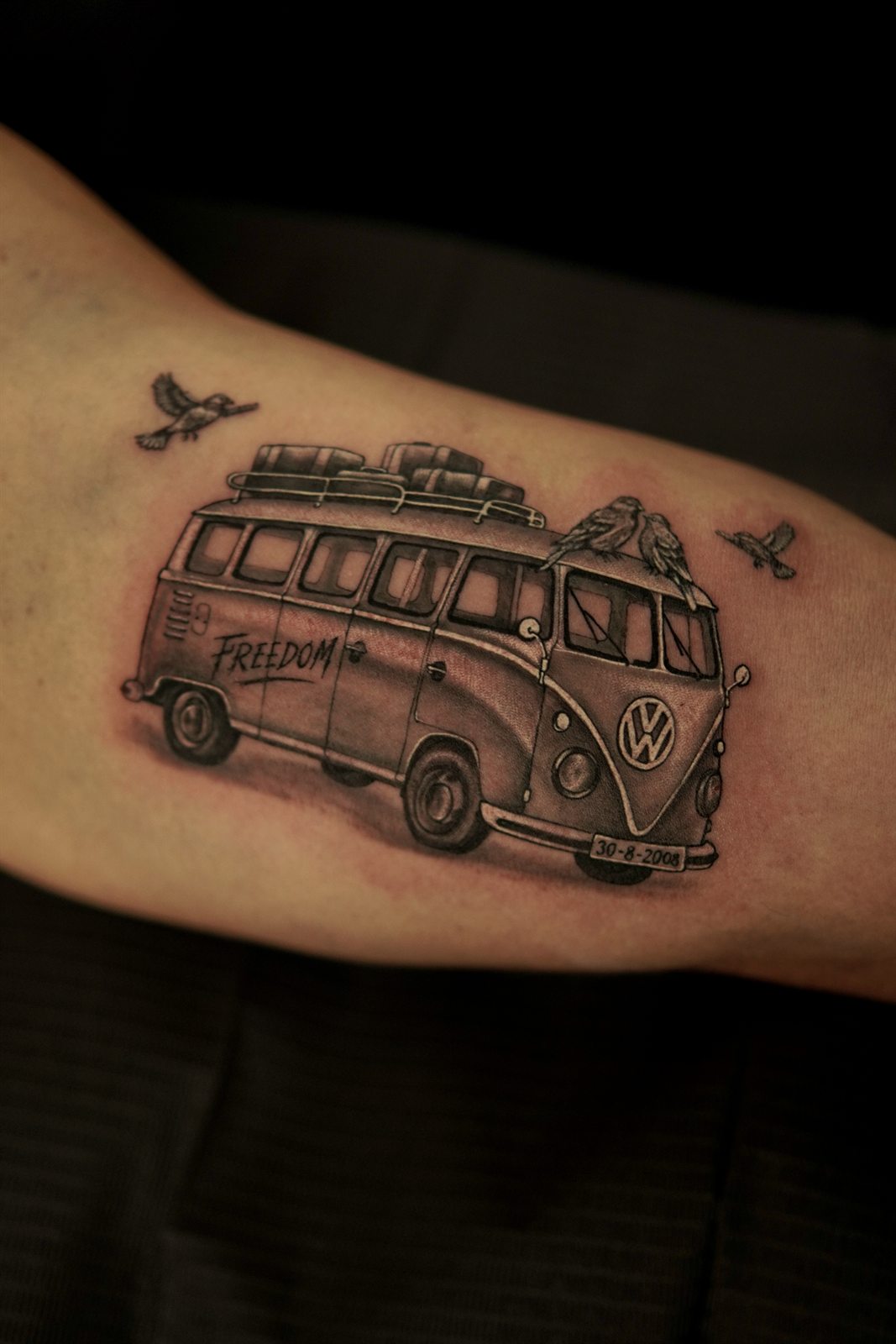 Realistic VW Kombi van tattoo reading Freedom