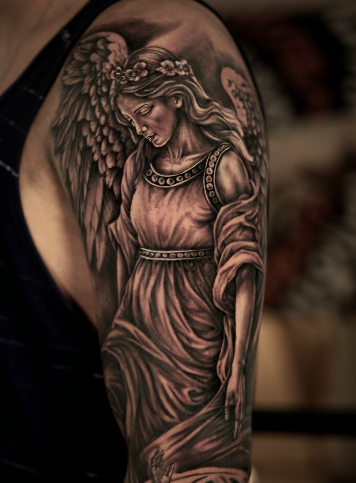 Black and grey realism guardian angel tattoo by Matheus dos Reis