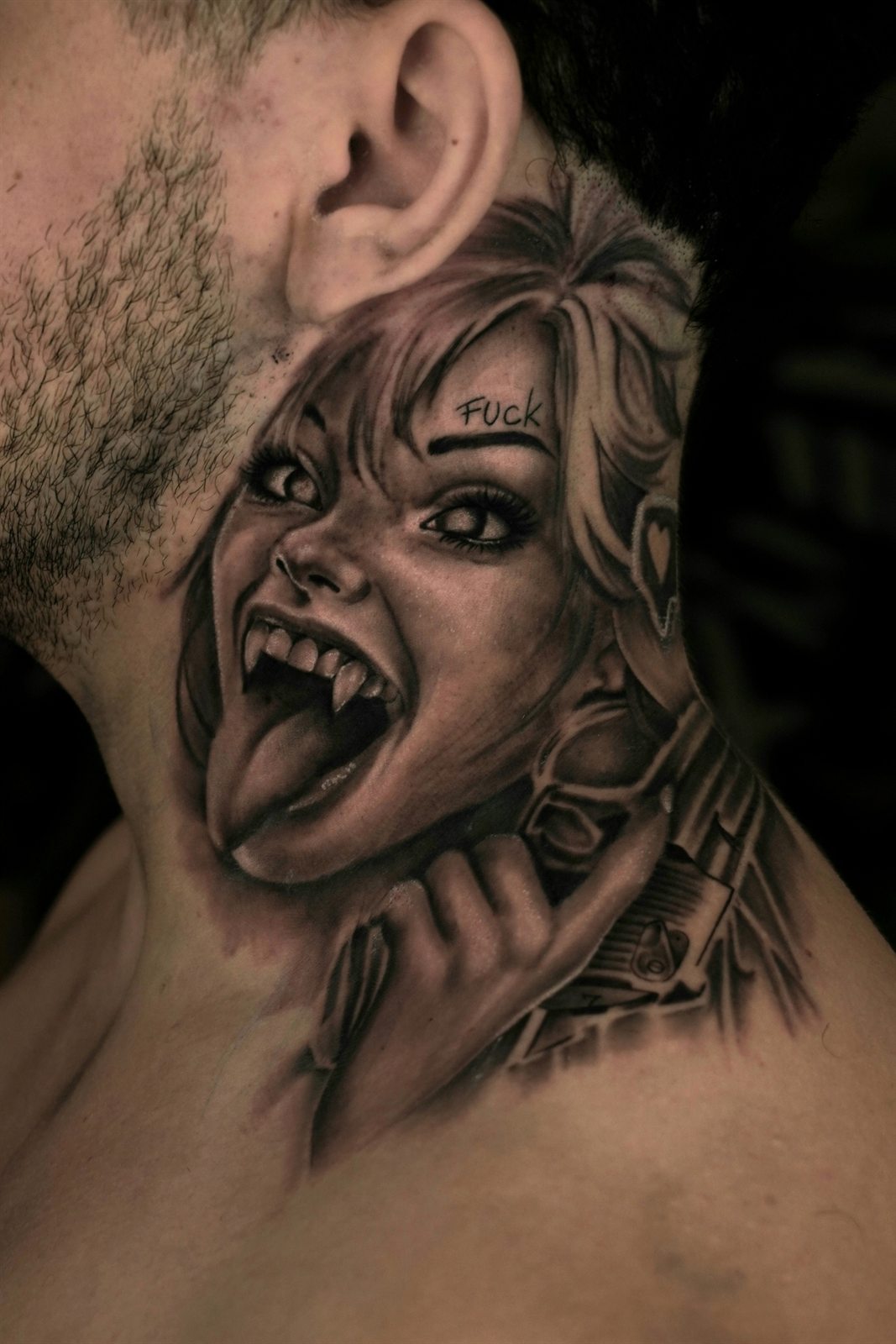 Black and grey vampire portrait tattoo on the neck